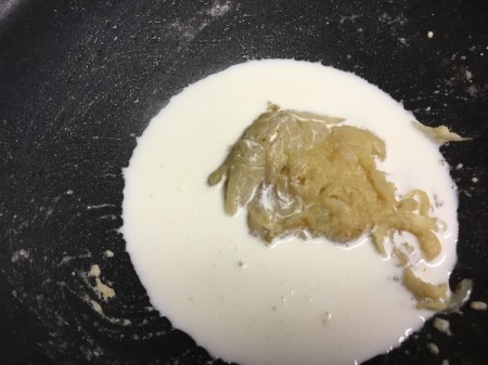 adding milk to onions