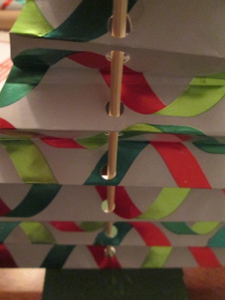 Making Accordion Christmas Trees - closeup of holes punched in paper