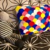 Dragon Scale Pillow - colorful pillow on black and white bed set