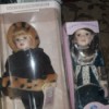 Value of a Collectible Memories Porcelain Doll - two dolls in boxes