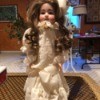 Porcelain Doll Identification and Value - doll in ivory period dress