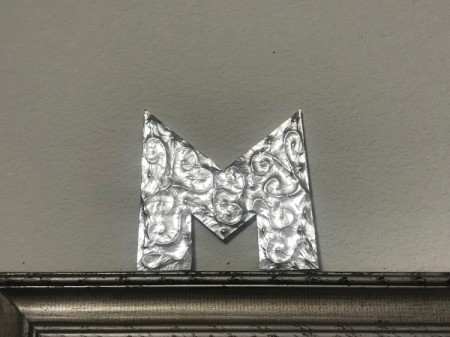 Foil Wrapped Cardboard Letter - letter on a shelf