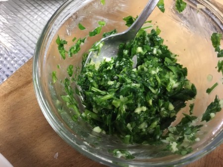 mixing butter and parsley