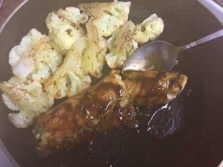 Herbed Chicken Rolls in Cherry Sauce with cauliflower in pan