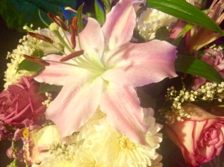 Ways to Save Money on Wedding Flowers - bouquet of flowers with pink and white lily in the center