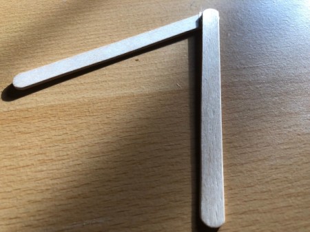 Popsicle Stick Geometric Sculpture - add a second stick and place a drop of glue on the end of the new stick