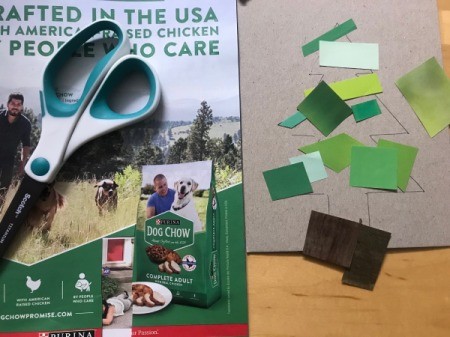 Recycled Christmas Card - cut out varying sizes and colors of green from the magazines for the tree and some brown for the trunk