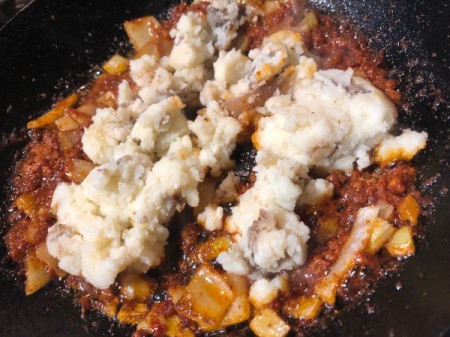 adding Potato to chorizo in skillet Skillet