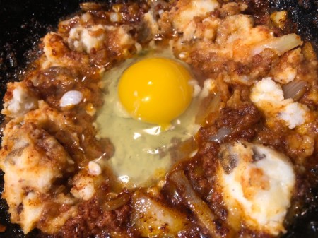 adding Egg to Skillet