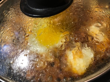 covering pan of Chorizo Potato Egg Skillet