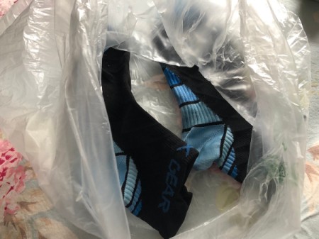 Partially dry socks in a plastic bag.