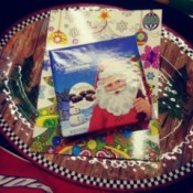 A seasonal tray with a coloring book and a box of chocolates.
