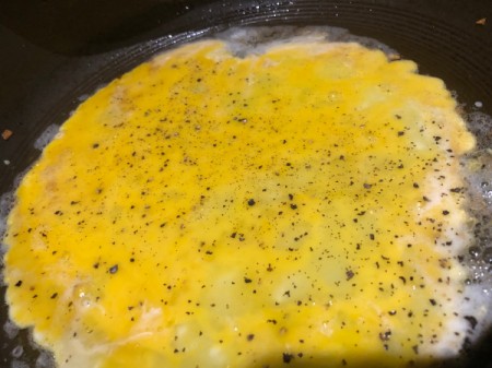 seasoning egg in pan