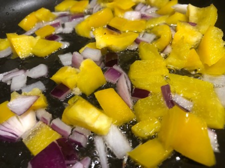 onions & peppers in pan