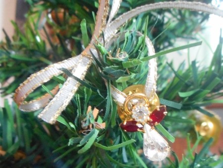 Use Costume Jewelry as Mini Ornaments - closeup of an angel pin ornament