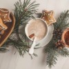 Gingerbread cookies, sprigs of pine and a cup of hot chocolate.