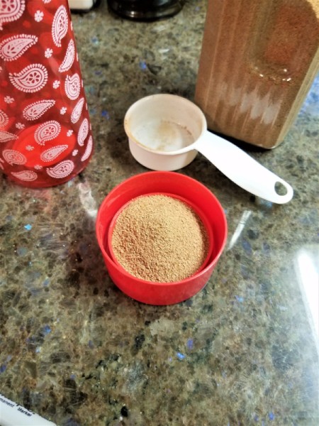 Cereal in the lid of a drink bottle.