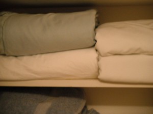 Folding Fitted Sheets - folded sheet sets on the closet shelf