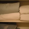 Folding Fitted Sheets - folded sheet sets on the closet shelf