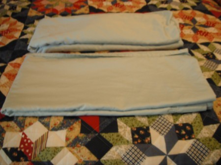 Folding Fitted Sheets - begin to fold flat sheet