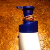 A rubber band on a lotion bottle to prevent the dispenser from going down fully.