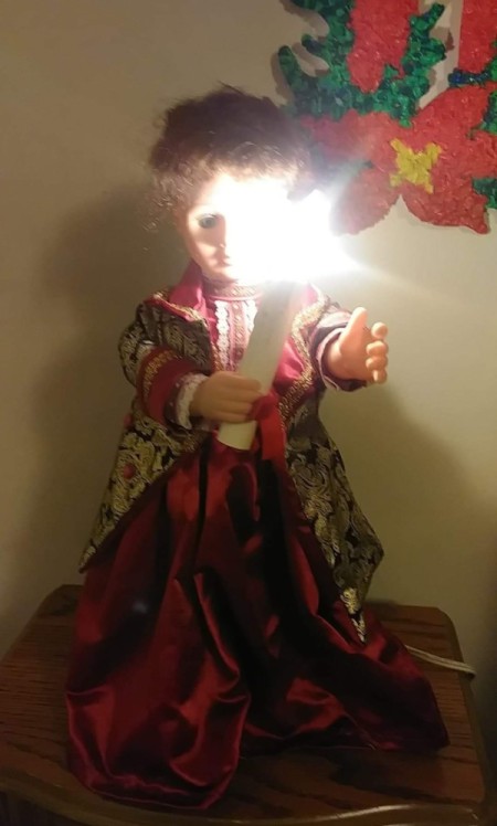 Identifying a Porcelain Doll - doll in long red dress holding a candle