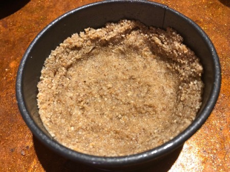 pressing crumbs in pan