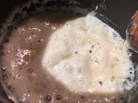adding flour to melted butter