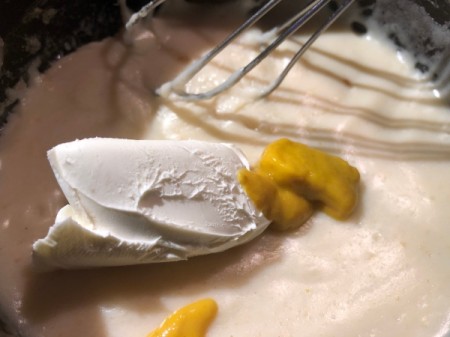 adding cream cheese & mustard to Sauce