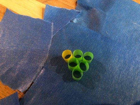 Fused Plastic Straw Ornament - press the pieces down firmly on the tape