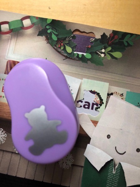 Kids' Cutout Paper Wreath - bear paper punch with pages with cutouts made