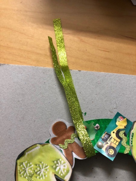 Kids' Cutout Paper Wreath - cut piece of ribbon slipped through the ring