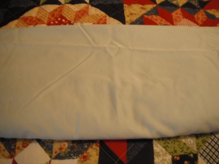 Folding Fitted Sheets - smooth and fold again lengthwise