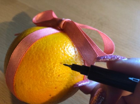 How to Make Orange Clove Pomanders - use pen to mark clove locations