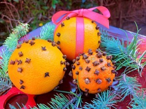 How to Make Orange Clove
Pomanders - three variations resting on a bed of evergreen branches