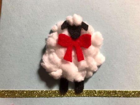 Puffy "Fleece Navidad" Card - cut small piece of the cotton balls reshape and stick above the head