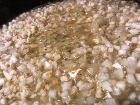 adding broth to Cauliflower Risotto