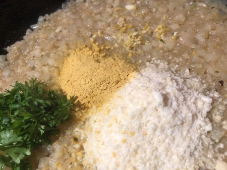 adding spices and cheese to Cauliflower Risotto