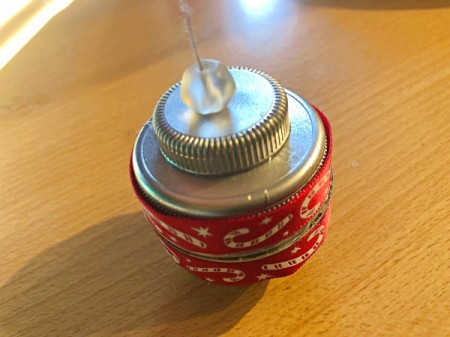 Plastic Bottle Cap Ornaments - ribbon glued to both large caps and a bead strung onto the string hanger