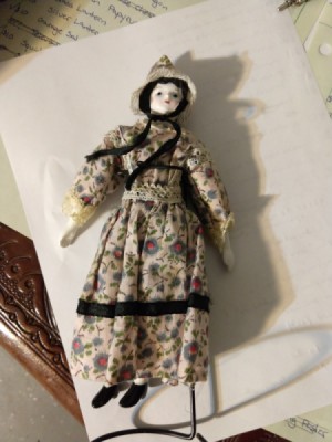 Identifying a Porcelain Doll - old style porcelain doll in print dress