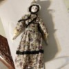 Identifying a Porcelain Doll - old style porcelain doll in print dress