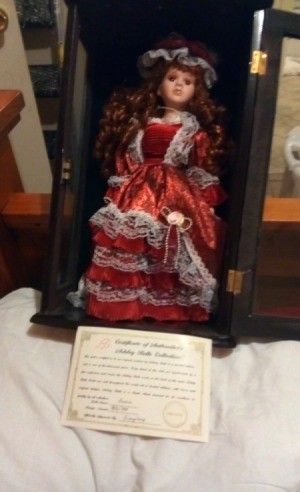 Value of an Ashley Belle Doll - doll wearing a red dress trimmed in white lace