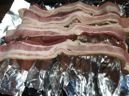 Bacon being baked in the oven.