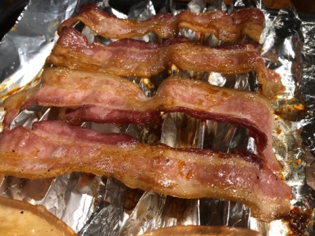 Oven baked bacon on foil.