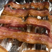 Oven baked bacon on foil.