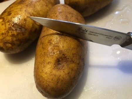 scouring raw potatoes