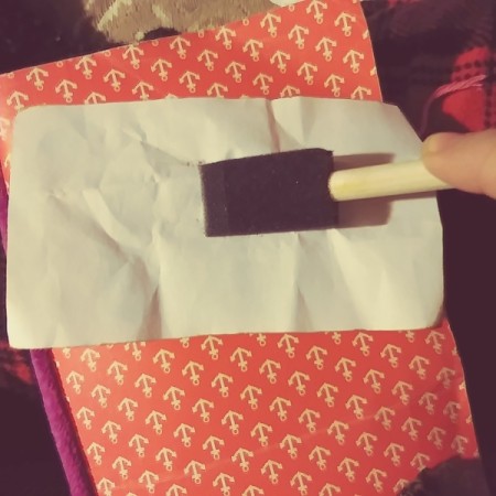 Distressing Paper with an Ink Pad - lay face down on the ink pad and lightly brush and then remove