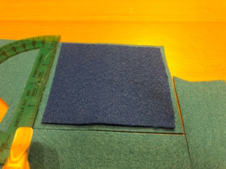 Children's Soft Puzzle - place background piece on top of another piece to cut a border slightly larger