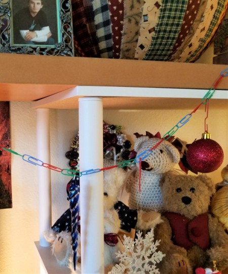 Garland Made from Dollar Tree Paperclips  - closeup in front of teddy bears on a shelf