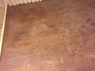 Leak Left White Powder Residue on Laminate Floor